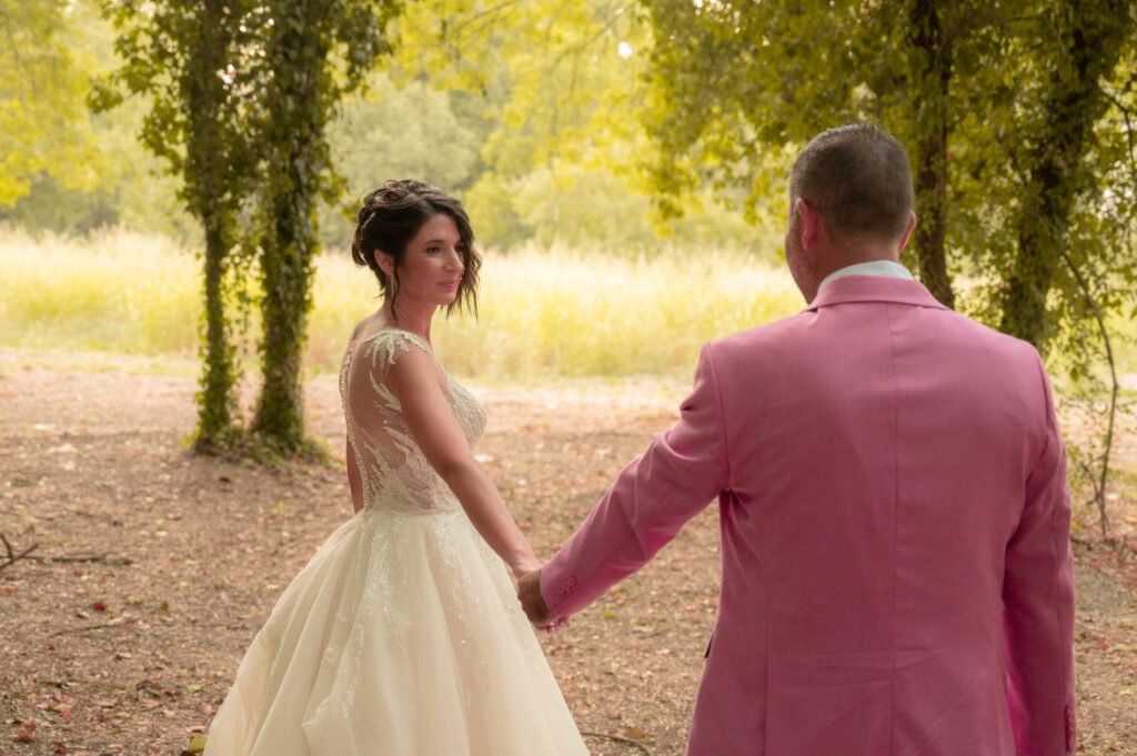 Bride and groom holding hands in Arta, Greece