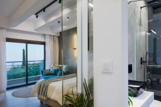 photography of airbnb bedroom with walk-in glass shower and wonderful views of Parga, Greece